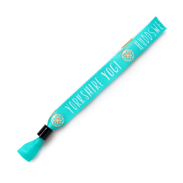 A teal cloth wristband with the words